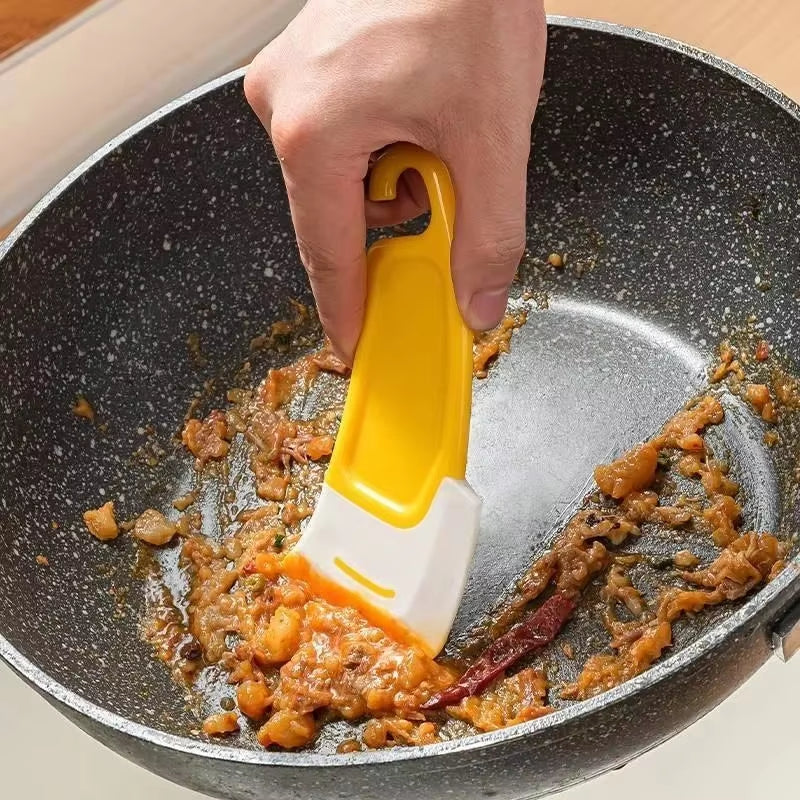 The "Pan Whisperer": Your Kitchen's Soft-Hearted Scraper for Tackling Grime and Gunk!