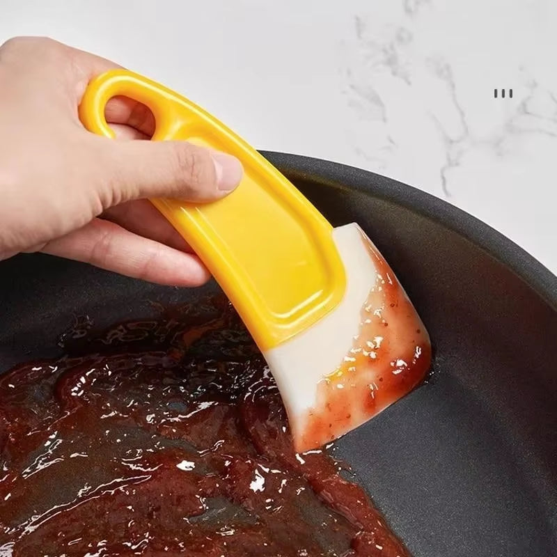 The "Pan Whisperer": Your Kitchen's Soft-Hearted Scraper for Tackling Grime and Gunk!